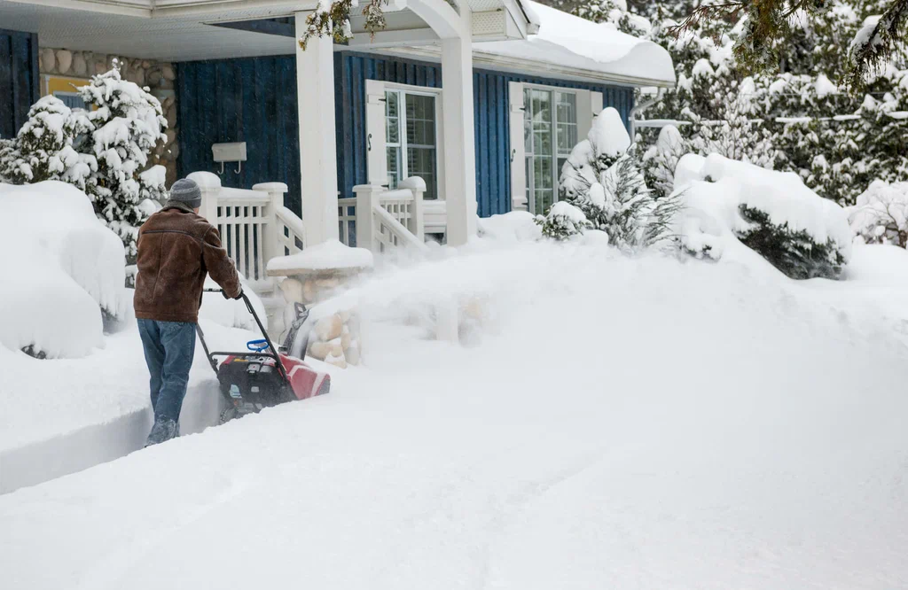De-icing and salting a commercial parking lot in Green Bay, Wisconsin