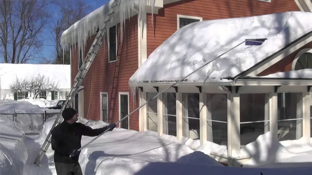 Roof ice dam removal on a Green Bay building