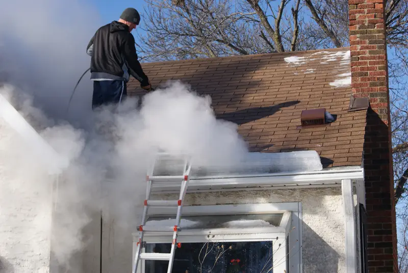 Steam ice dam removal on a roof in Green Bay, Wisconsin
