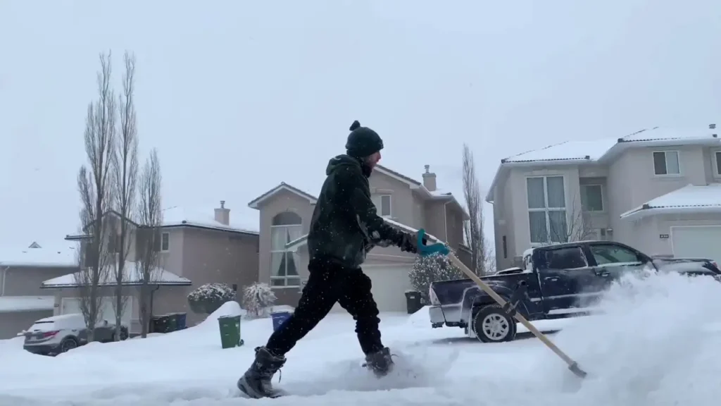 The Titletown Snow Removal crew clearing a driveway in Green Bay, Wisconsin