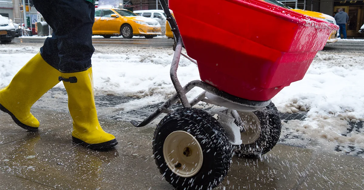 Commercial ice removal Bellevue, WI deicing a storefront walkway