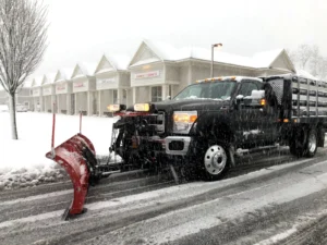 Commercial snow removal Allouez, WI clearing a business parking lot