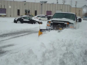 Commercial snow removal Ashwaubenon, WI clearing a business parking lot