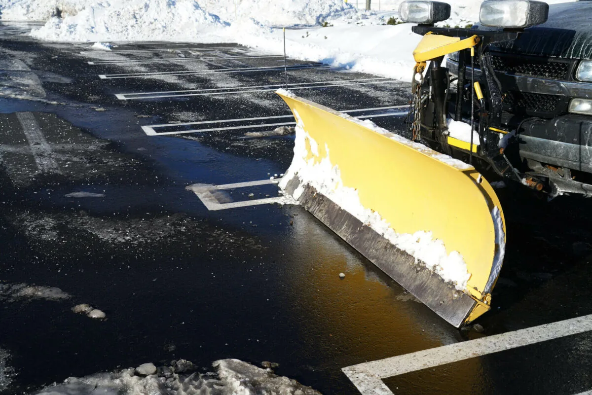 Commercial snow removal Bellevue, WI clearing a business parking lot