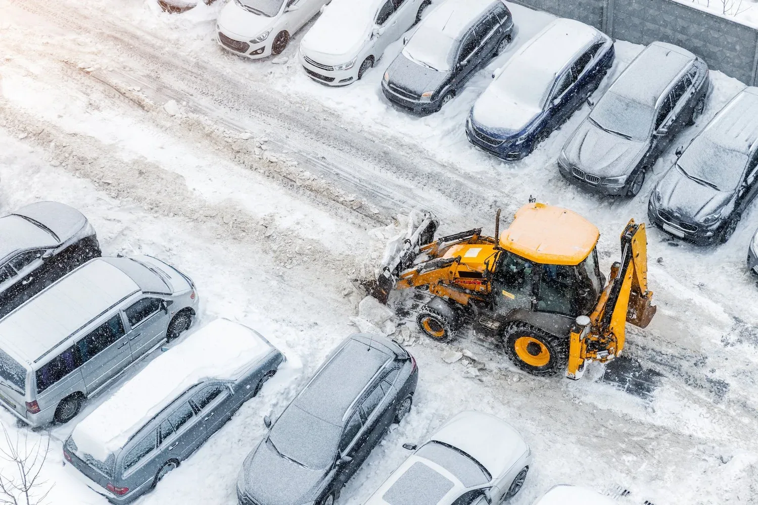 Commercial snow removal De Pere, WI clearing a business parking lot