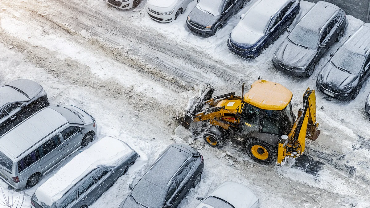 Commercial snow removal Howard, WI clearing a business parking lot