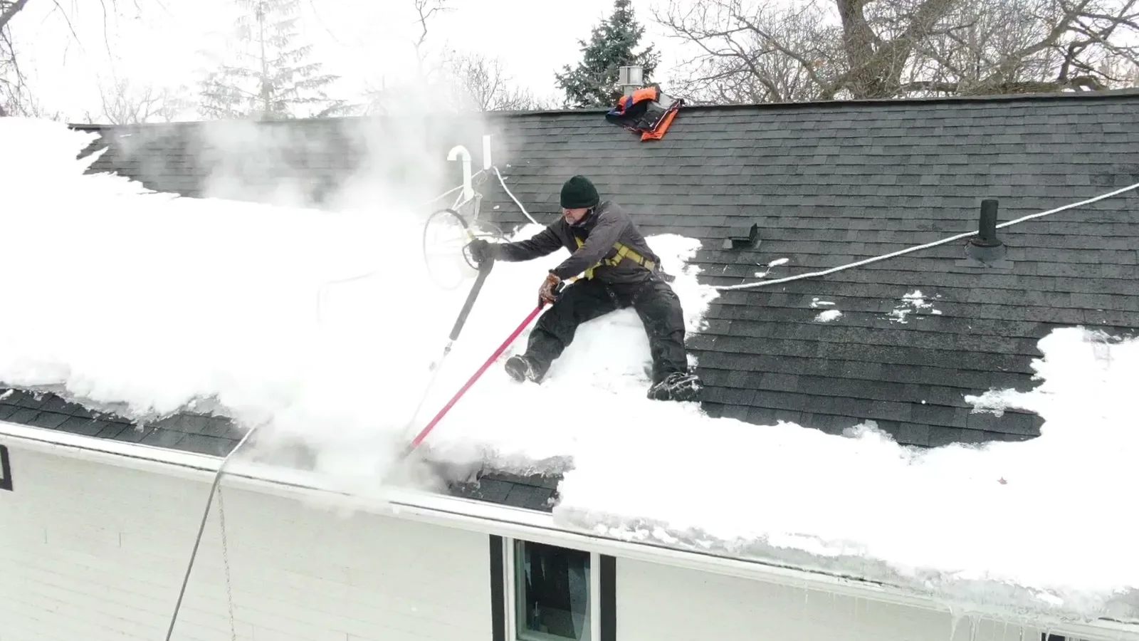 Ice dam removal De Pere, WI using steam on a residential roof