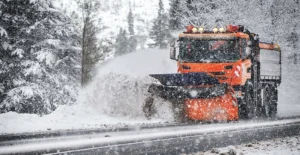 Snow plowing Allouez, WI clearing a driveway early morning