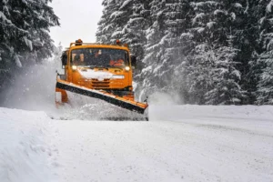 Snow plowing Ashwaubenon, WI clearing a driveway early morning