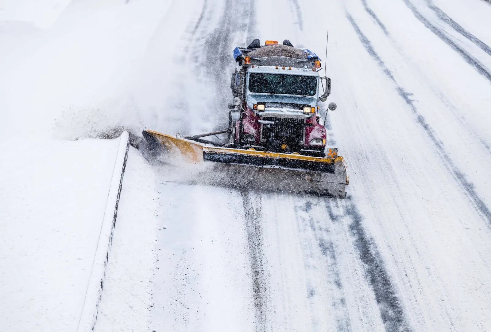 Snow plowing De Pere, WI clearing a driveway early morning